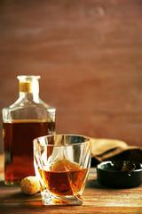Whiskey on wooden background