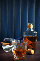 Whiskey on wooden background