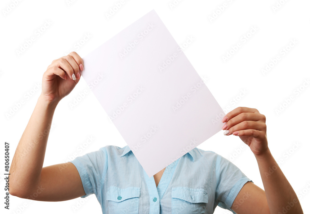 Wall mural woman covering her face with blank sheet of paper isolated