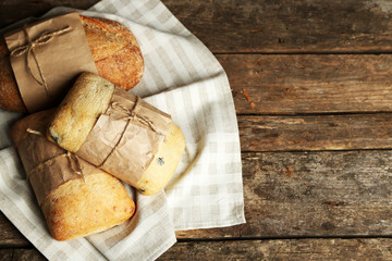 Fresh bread on old wooden table