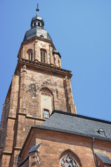 Fototapeta na wymiar Wall fragment and spire of Cathedral of Holy Spirit in Heidelber