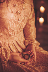 Obraz premium Portrait of beautiful young woman with candles