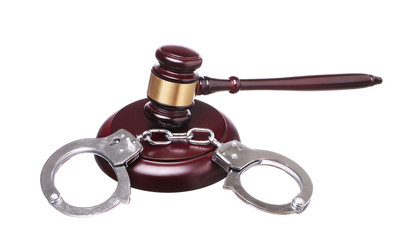 judge gavel and handcuffs isolated on white background.