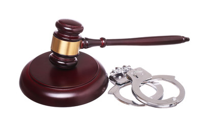 judge gavel and handcuffs isolated on white background.