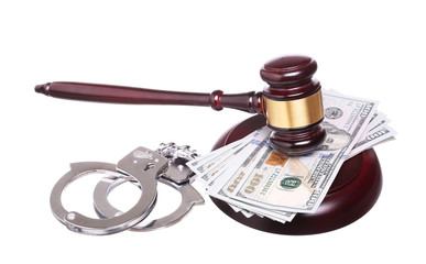 judge gavel and handcuffs with money isolated on white backgroun