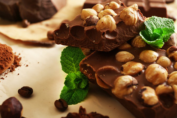 Chocolate with nuts, spices and mint, closeup
