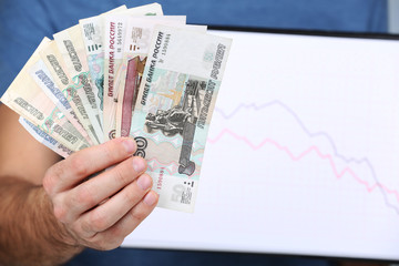 Man holding money and graph document close up