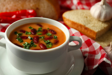 Bean soup in bowl with fresh sliced bread