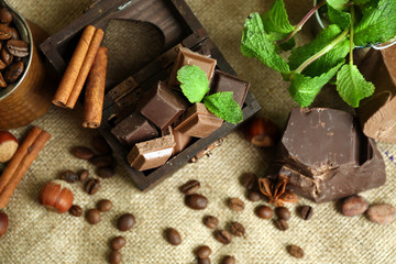 Still life with set of chocolate on burlap cloth, closeup