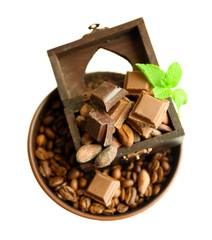 Still life with set of chocolate and coffee grains isolated