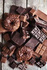 Set of chocolate on wooden table, closeup