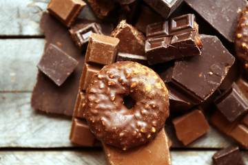 Set of chocolate on wooden table, closeup