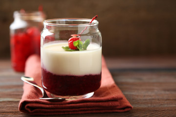 Glass jar with tasty panna cotta dessert