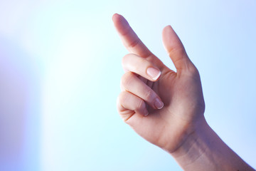 Female hand on colorful background