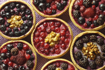 Autumn fruit cakes on purple background