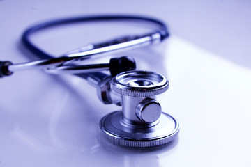 Medical stethoscope in white background