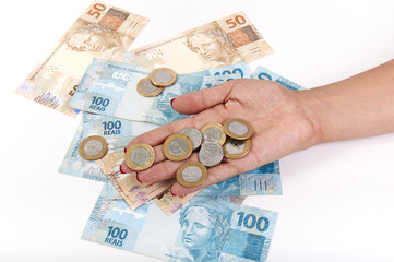 Woman's hand and Brazilian money