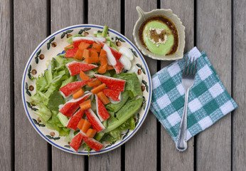 Crab stick salad with wasabi dressing from top