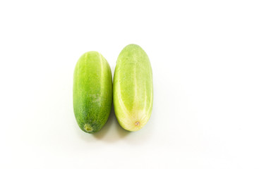 Five green cucumbers in  on white background