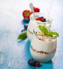 Healthy breakfast - yogurt with muesli and berries