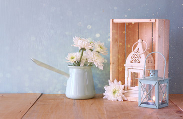 summer bouquet of flowers on the wooden table with glitter backg