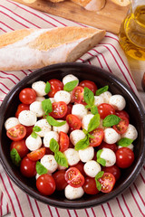 Caprese salad with mozzarella, tomato and basil