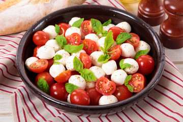 Caprese salad with mozzarella, tomato and basil