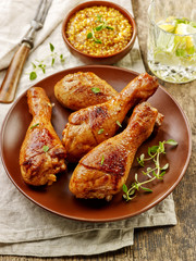 chicken legs on brown plate