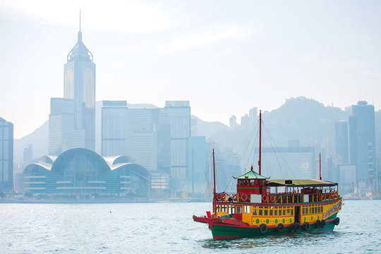 Ferry in Hong Kong with Victoria Harbour in background