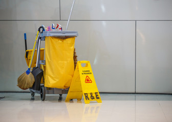 Mop bucket and caution sign