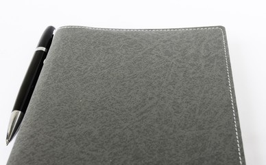 Diary book and pen on isolate background