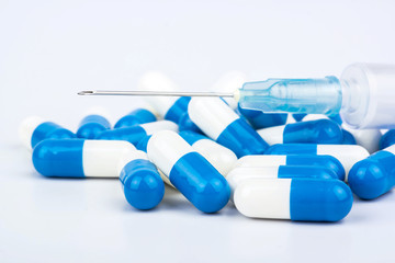 Capsules and syringe