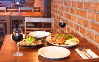 retro restaurant interior with thai food and red wine
