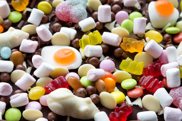 Chocolate cake decorated with loads of sweets