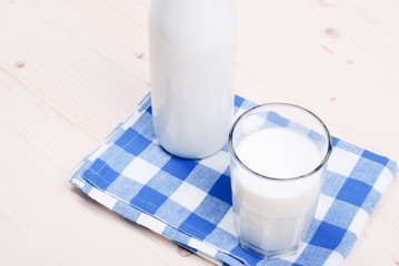 milk in glass containers on a table top view