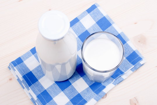 milk in glass containers on a table top view