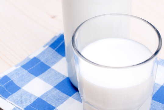 milk in glass containers on a table top view