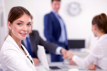 Business people sitting and discussing at business meeting