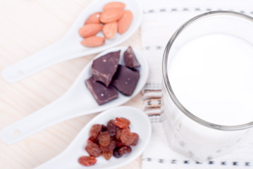 milk, almonds, raisins, dried apricots on the table top view