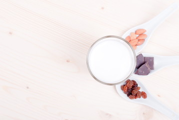 milk, almonds, raisins, dried apricots on the table top view