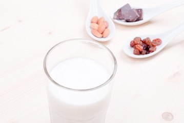 milk, almonds, raisins, dried apricots on the table top view