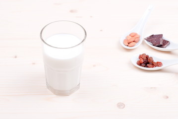 milk, almonds, raisins, dried apricots on the table top view