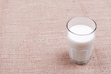 milk in glass containers on a table top view