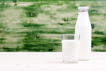 milk in a glass on the table side view