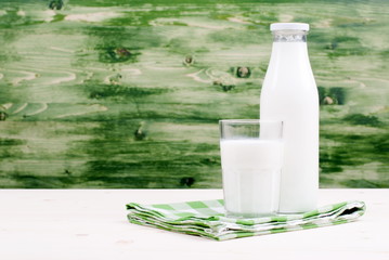 milk in a glass on the table side view