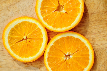 Orange with pieces on cutting board