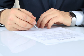 Businessman is signing a contract, business contract details