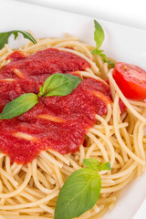 Pasta with tomato sauce and basil.