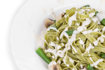 Pasta tagliatelle with green peas and ham.