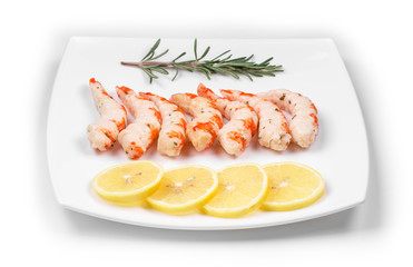 Cooked unshelled shrimps with lemon.